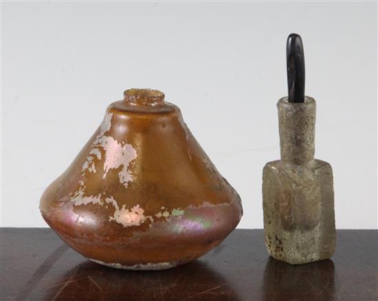 An Islamic glass unguent container, c.600 AD and a Roman glass vessel, 2nd - 4th century AD, 7cm